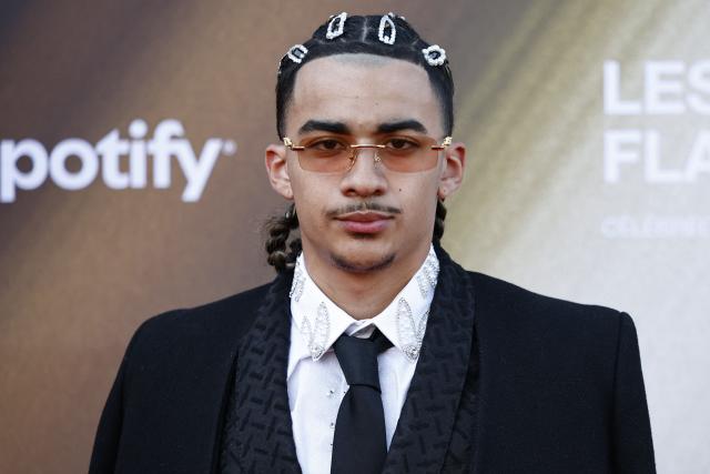 French singer TKS 2G poses for a photocall upon arrival for the fourth edition of "Les Flammes" music award ceremony at the Seine Musicale, in Boulogne-Billancourt, in the western outskirts of Paris on April 23, 2026. (Photo by SIMON WOHLFAHRT / AFP)