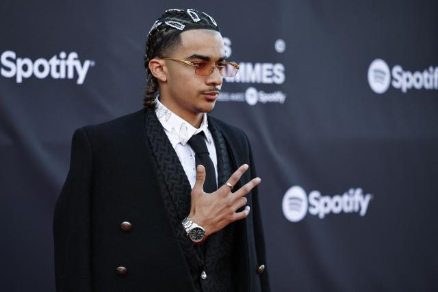 French singer TKS 2G poses for a photocall upon arrival for the fourth edition of "Les Flammes" music award ceremony at the Seine Musicale, in Boulogne-Billancourt, in the western outskirts of Paris on April 23, 2026. (Photo by SIMON WOHLFAHRT / AFP)