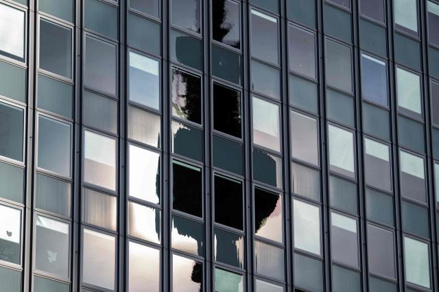 A silhouette of the TV Tower is reflected in the facade of the Haus des Lehrers (House of The Teacher), at Berlin's Alexanderplatz on April 23, 2026. (Photo by John MACDOUGALL / AFP)
