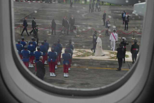 Pope Leo XIV boards the papal flight from Malabo to Rome, on April 23, 2026, at the end of his 11-day pastoral visit to Africa. (Photo by Andrew Medichini / POOL / AFP)