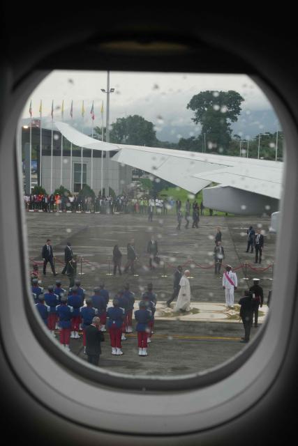 Pope Leo XIV boards the papal flight from Malabo to Rome, on April 23, 2026, at the end of his 11-day pastoral visit to Africa. (Photo by Andrew Medichini / POOL / AFP)