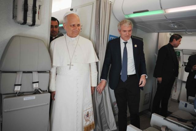 Pope Leo XIV speaks to journalists aboard the papal flight from Malabo to Rome, on April 23, 2026, at the end of his 11-day pastoral visit to Africa. (Photo by Andrew Medichini / POOL / AFP)