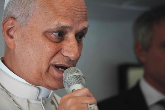 Pope Leo XIV speaks to journalists aboard the papal flight from Malabo to Rome, on April 23, 2026, at the end of his 11-day pastoral visit to Africa. (Photo by Andrew Medichini / POOL / AFP)