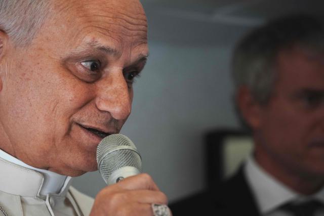 Pope Leo XIV speaks to journalists aboard the papal flight from Malabo to Rome, on April 23, 2026, at the end of his 11-day pastoral visit to Africa. (Photo by Andrew Medichini / POOL / AFP)
