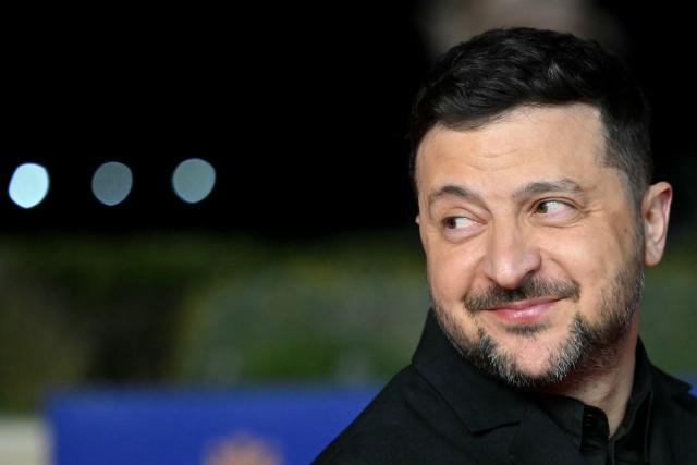 Ukraine's President Volodymyr Zelensky walks upon his arrival ahead of an informal meeting of the European Council, in Ayia Napa on April 23, 2026. (Photo by NICOLAS TUCAT / AFP)