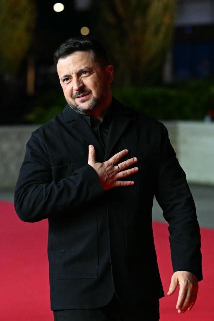 Ukraine's President Volodymyr Zelensky walks upon his arrival ahead of an informal meeting of the European Council, in Ayia Napa on April 23, 2026. (Photo by NICOLAS TUCAT / AFP)