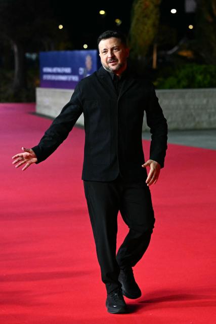 Ukraine's President Volodymyr Zelensky walks upon his arrival ahead of an informal meeting of the European Council, in Ayia Napa on April 23, 2026. (Photo by NICOLAS TUCAT / AFP)