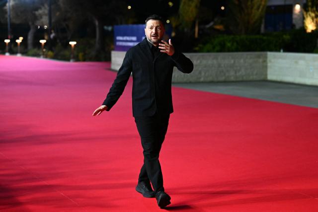 Ukraine's President Volodymyr Zelensky walks upon his arrival ahead of an informal meeting of the European Council, in Ayia Napa on April 23, 2026. (Photo by NICOLAS TUCAT / AFP)
