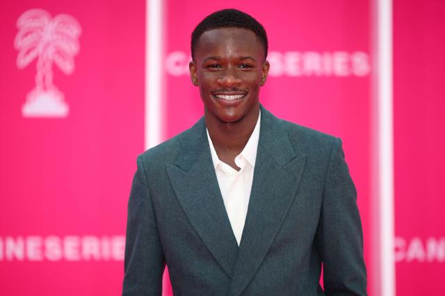 French actor Mamadou Sidibe poses on the pink carpet during the opening of the 9th edition of the Cannes International Series Festival (Canneseries) in Cannes, southern France, on April 23, 2026.  (Photo by Valery HACHE / AFP)