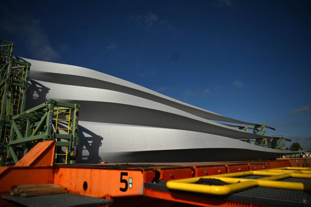 Blades for the construction of wind turbines are ready for shipping at the harbour in Emden, northwestern Germany, on April 23, 2026 during a media day ahead of the National Maritime Conference. The National Maritime Conference (NMK), scheduled for April 29 and 30, 2026, is the German government's central event for supporting the maritime industry. (Photo by Ina FASSBENDER / AFP)