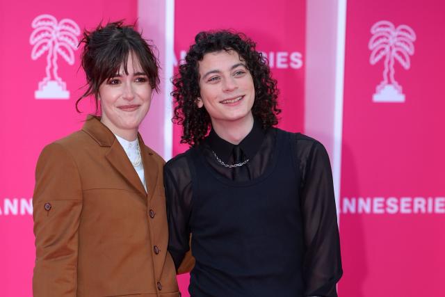 French actress Lou Howard and French comedian Roman Doduik pose on the pink carpet during the opening of the 9th edition of the Cannes International Series Festival (Canneseries) in Cannes, southern France, on April 23, 2026.  (Photo by Valery HACHE / AFP)