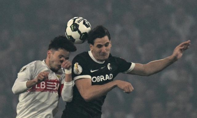 Stuttgart's German midfielder #16 Atakan Karazor (L) and Freiburg's German forward #31 Igor Matanovic (2nd L) vie for the ball during the German Cup (DFB-Pokal) semi-final football match between VfB Stuttgart and FC Freiburg in Stuttgart, southwestern Germany, on April 23, 2026. (Photo by THOMAS KIENZLE / AFP) / DFB REGULATIONS PROHIBIT ANY USE OF PHOTOGRAPHS AS IMAGE SEQUENCES AND QUASI-VIDEO.