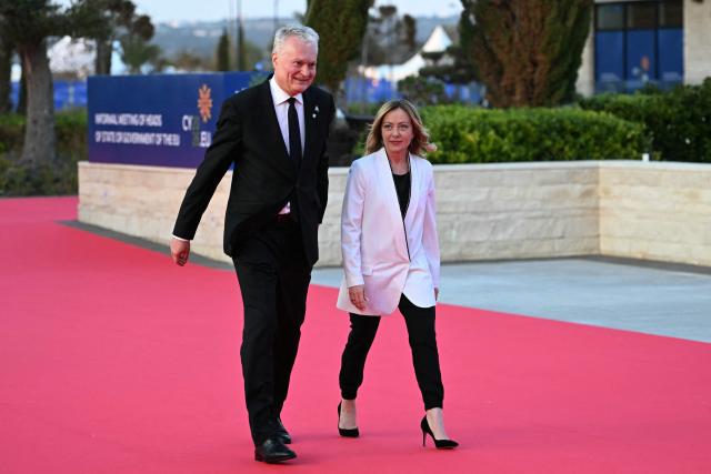 Lithuania's President Gitanas Nauseda (L) and Italy's Prime Minister Giorgia Meloni walk upon their arrival ahead of an informal meeting of the European Council, in Ayia Napa on April 23, 2026. (Photo by NICOLAS TUCAT / AFP)