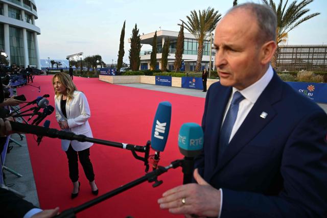 Ireland's Prime Minister Micheal Martin (R) and Italy's Prime Minister Giorgia Meloni speak to the media upon their arrival ahead of an informal meeting of the European Council, in Ayia Napa on April 23, 2026. (Photo by NICOLAS TUCAT / AFP)