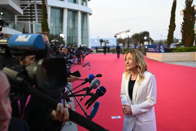Italy's Prime Minister Giorgia Meloni speaks to the media upon her arrival ahead of an informal meeting of the European Council, in Ayia Napa on April 23, 2026. (Photo by NICOLAS TUCAT / AFP)