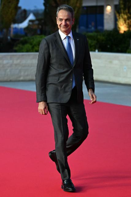 Greece's Prime Minister Kyriakos Mitsotakis walks upon his arrival ahead of an informal meeting of the European Council, in Ayia Napa on April 23, 2026. (Photo by NICOLAS TUCAT / AFP)