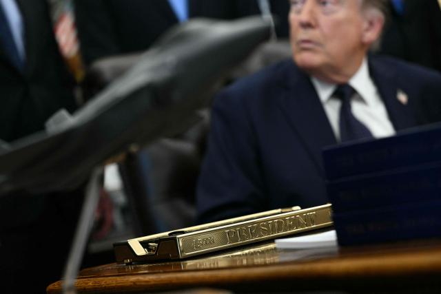 US President Donald Trump listens during a health care affordability event in the Oval Office of White House in Washington, DC, on April 23, 2026. (Photo by Brendan SMIALOWSKI / AFP)