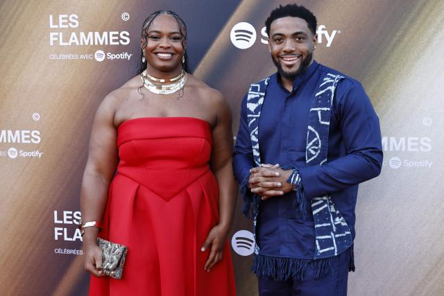 French judoka Romane Dicko (L) poses with a guest for a photocall upon arrival for the fourth edition of "Les Flammes" music award ceremony at the Seine Musicale, in Boulogne-Billancourt, in the western outskirts of Paris on April 23, 2026. (Photo by SIMON WOHLFAHRT / AFP)