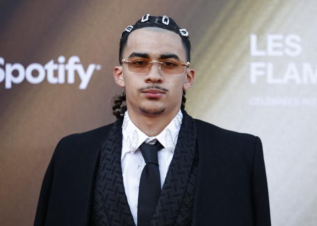 French singer TKS 2G poses for a photocall upon arrival for the fourth edition of "Les Flammes" music award ceremony at the Seine Musicale, in Boulogne-Billancourt, in the western outskirts of Paris on April 23, 2026. (Photo by SIMON WOHLFAHRT / AFP)