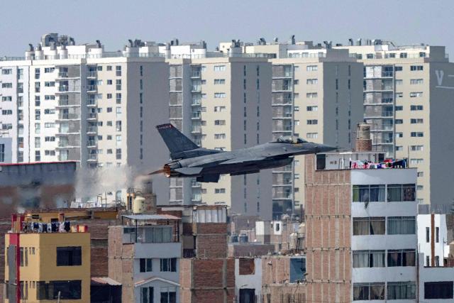 An F-16 fighter jet flies during an exhibition over Las Palmas air base in Lima on April 23, 2026. US defense group Lockheed Martin confirmed the purchase by Peru of 12 F-16 fighter jets in a deal that sparked fierce divisions within Peru's government on April 23, 2026. (Photo by Ernesto BENAVIDES / AFP)