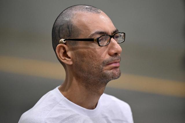 Dionisio Aristides Umanzor, also known as "Sirra," leader of the Mara Salvatrucha (MS-13) gang, attends a remote court hearing by videoconference at the Terrorism Confinement Center (CECOT) in Tecoluca, El Salvador on April 23, 2026. (Photo by Marvin RECINOS / AFP)