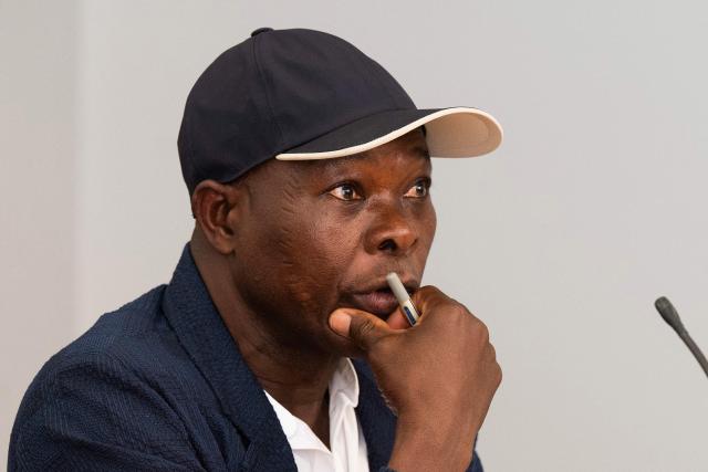Architect Francis Kere, who designed the Goethe-Institut building, speaks during a press conference at the Goethe-Institut German cultural centre in Dakar on April 16, 2026. The bricks are local, the open-air ventilation is abundant, and a single towering baobab unites it all: architect Francis Kere's new building in Dakar is simultaneously sustainable and distinctly African.
A dual national of Burkina Faso and Germany, Kere is the only African to have won the Pritzker Prize (2022), architecture's most prestigious award. (Photo by SEYLLOU / AFP)