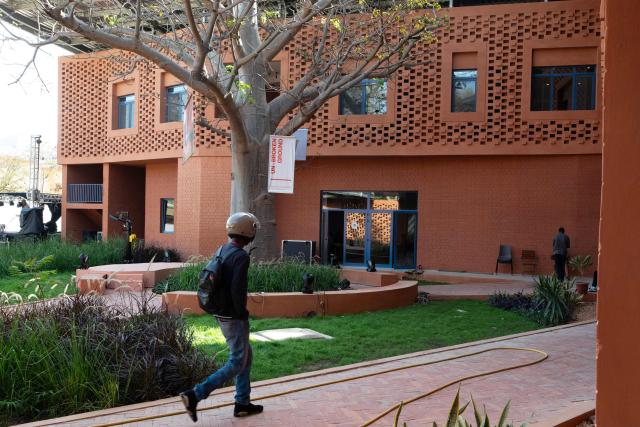 A general view of the Goethe-Institut German cultural centre in Dakar on April 16, 2026. The bricks are local, the open-air ventilation is abundant, and a single towering baobab unites it all: architect Francis Kere's new building in Dakar is simultaneously sustainable and distinctly African.
A dual national of Burkina Faso and Germany, Kere is the only African to have won the Pritzker Prize (2022), architecture's most prestigious award. (Photo by SEYLLOU / AFP)