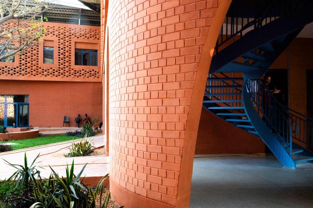 A general view of the Goethe-Institut German cultural centre in Dakar on April 16, 2026. The bricks are local, the open-air ventilation is abundant, and a single towering baobab unites it all: architect Francis Kere's new building in Dakar is simultaneously sustainable and distinctly African.
A dual national of Burkina Faso and Germany, Kere is the only African to have won the Pritzker Prize (2022), architecture's most prestigious award. (Photo by SEYLLOU / AFP)