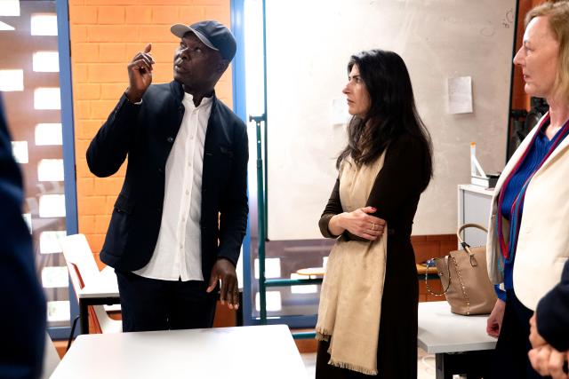 Architect Francis Kere (L) speaks to German politician Serap Guler (C) at the Goethe-Institut German cultural centre in Dakar on April 16, 2026. The bricks are local, the open-air ventilation is abundant, and a single towering baobab unites it all: architect Francis Kere's new building in Dakar is simultaneously sustainable and distinctly African.
A dual national of Burkina Faso and Germany, Kere is the only African to have won the Pritzker Prize (2022), architecture's most prestigious award. (Photo by SEYLLOU / AFP)