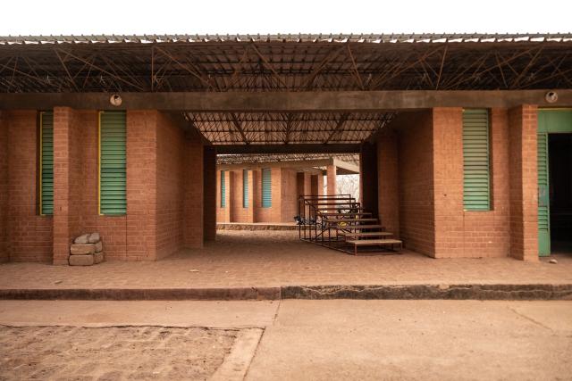 (FILES) A general view of the Village-Opera school, designed by Architect Diebedo Francis Kere, in Laongo, on March 16, 2022. A dual national of Burkina Faso and Germany, Kere is the only African to have won the Pritzker Prize (2022), architecture's most prestigious award.
His Berlin-based firm's latest building, the Goethe-Institut German cultural centre in Senegal's capital, embodies his trademarks: simple, local materials, a commitment to Africa, and design principles that are simultaneously aesthetic and comfortable.
Kere's work is rooted in Africa using bioclimatic principles that take into account climate conditions and available local resources. (Photo by OLYMPIA DE MAISMONT / AFP)