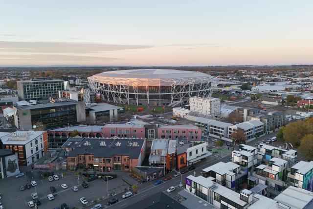A aerial photo shows a general view outside the One New Zealand Stadium seen prior to the starting super round of the Super Rugby Pacific in Christchurch on April 24, 2026. The new 400 million USD Te Kaha stadium that was a symbol of Christchurch's struggle to rebuild after a deadly earthquake struck the New Zealand city will host its first match on April 24, in front of a sellout rugby crowd. (Photo by Sanka Vidanagama / AFP)