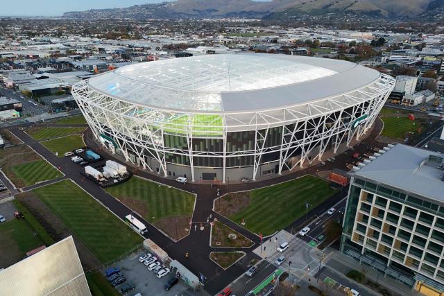 A aerial photo shows a general view outside the One New Zealand Stadium seen prior to the starting super round of the Super Rugby Pacific in Christchurch on April 24, 2026. The new 400 million USD Te Kaha stadium that was a symbol of Christchurch's struggle to rebuild after a deadly earthquake struck the New Zealand city will host its first match on April 24, in front of a sellout rugby crowd. (Photo by Sanka Vidanagama / AFP)