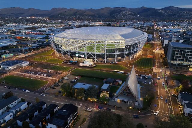 A aerial photo shows a general view outside the One New Zealand Stadium seen prior to the starting super round of the Super Rugby Pacific in Christchurch on April 24, 2026. The new 400 million USD Te Kaha stadium that was a symbol of Christchurch's struggle to rebuild after a deadly earthquake struck the New Zealand city will host its first match on April 24, in front of a sellout rugby crowd. (Photo by Sanka Vidanagama / AFP)