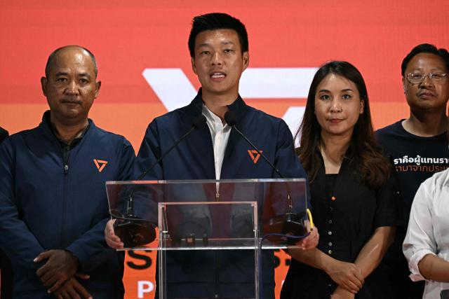 (FILES) People's Party leader and prime ministerial candidate Natthaphong Ruengpanyawut (C) speaks at his party's headquarters while conceding defeat in Thailand's general election in Bangkok on February 8, 2026. A Thai court on April 24 decided to hear a case against 10 MPs including the leader of the largest opposition party for trying to reform the royal insult law, but refrained from suspending them. (Photo by Lillian SUWANRUMPHA / AFP)