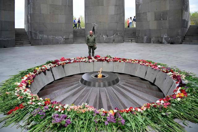 Artur Avanesyan, an army veteran and member of the 'Strong Armenia' party led by billionaire opposition figure Samvel Karapetyan, visits the Tsitsernakaberd Armenian Genocide Memorial in Yerevan on April 23, 2026, on the eve of the Genocide Remembrance Day - which will mark the 111th anniversary of the World War I-era mass killings of Armenians under the Ottoman Empire in 1915. (Photo by KAREN MINASYAN / AFP)