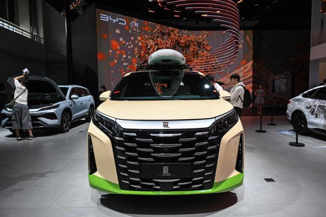 BYD's Xia model car is displayed at the Beijing Auto Show in Beijing on April 24, 2026. (Photo by JADE GAO / AFP)