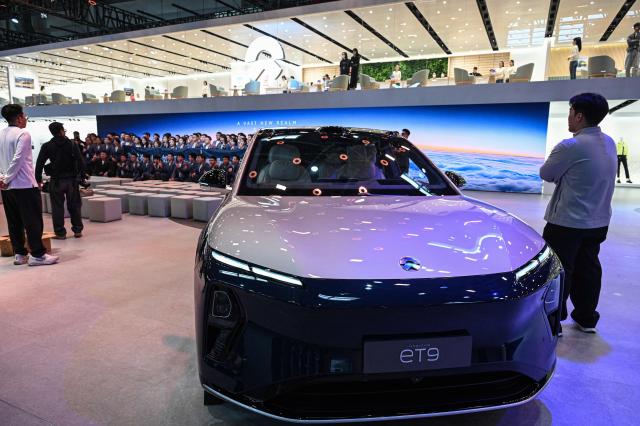 A NIO's ET9 electric car is displayed at the Beijing Auto Show in Beijing on April 24, 2026. (Photo by JADE GAO / AFP)