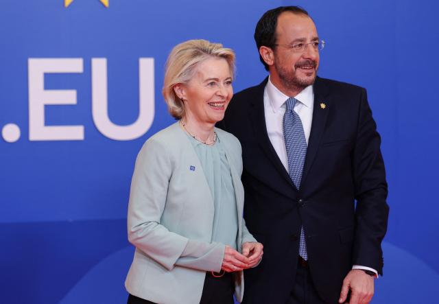 Cyprus' President Nikos Christodoulides (R) welcomes European Commission President Ursula von der Leyen ahead of an informal meeting of the European Council in Nicosia on April 24, 2026. (Photo by Yves Herman / POOL / AFP)