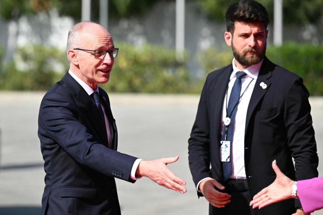 Luxembourg's Prime Minister Luc Frieden (L) arrives for an informal meeting of the European Council in Nicosia on April 24, 2026. (Photo by NICOLAS TUCAT / AFP)