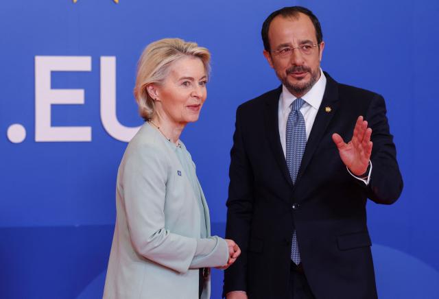 Cyprus' President Nikos Christodoulides (R) welcomes European Commission President Ursula von der Leyen ahead of an informal meeting of the European Council in Nicosia on April 24, 2026. (Photo by Yves Herman / POOL / AFP)
