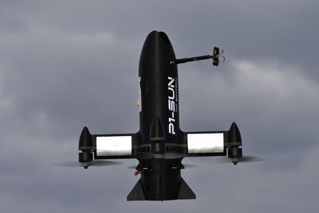 (FILES) This photograph shows a P1-Sun interceptor drone during a test flight at an undisclosed location in Ukraine on March 19, 2026, amid the Russian invasion of Ukraine. They mass-produce drones at virtually no cost and are constantly innovating: Ukrainian drone manufacturers are quietly traveling across France to share expertise forged in a war where these machines have already revolutionized combat and outpaced European armies. (Photo by Genya SAVILOV / AFP)