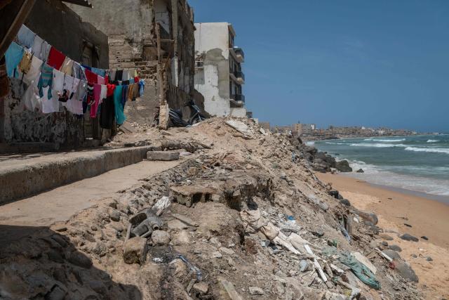 A panoramic view of the coastline at Yoff Beach in Dakar, Senegal, on April 23, 2026. According to a report published today, Yoff Beach is one of the sites identified as ‘at risk’ and requiring significant efforts to maintain water sports activities. A campaign to improve the quality of recreational waters in Senegal was launched today by the Surfrider Foundation Senegal and dozens of organisations along the Dakar coastline committed to protecting the ocean. They are leading a ‘Water Quality’ programme aimed at ensuring that coastal users can enjoy water-based activities without health risks, whilst contributing to the sustainable preservation of Senegal’s coastline. (Photo by NICOLAS REMENE / AFP)