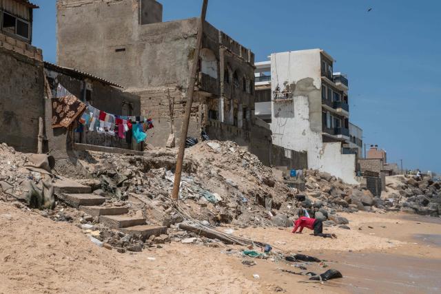 A panoramic view of the coastline at Yoff Beach in Dakar, Senegal, on April 23, 2026. According to a report published today, Yoff Beach is one of the sites identified as ‘at risk’ and requiring significant efforts to maintain water sports activities. A campaign to improve the quality of recreational waters in Senegal was launched today by the Surfrider Foundation Senegal and dozens of organisations along the Dakar coastline committed to protecting the ocean. They are leading a ‘Water Quality’ programme aimed at ensuring that coastal users can enjoy water-based activities without health risks, whilst contributing to the sustainable preservation of Senegal’s coastline. (Photo by NICOLAS REMENE / AFP)
