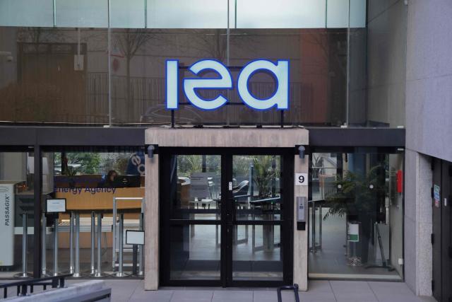 (FILES) This photograph shows the entrance to the International Energy Agency (IEA) headquarters in Paris on March 11, 2026. Liquefied natural gas (LNG) supplies are likely to remain strained through the end of 2027 due to disruptions and infrastructure damage from the US-Iran war, the International Energy Agency said on April 24, 2026. (Photo by Ludovic MARIN / AFP)