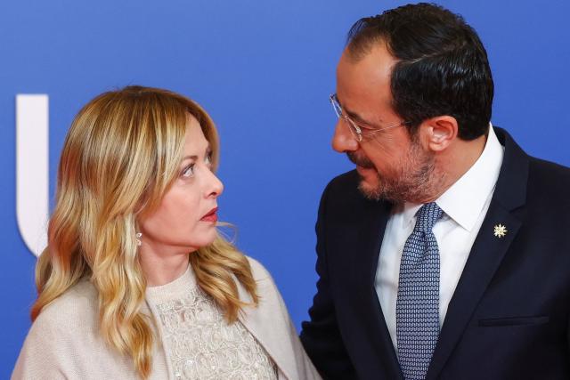 Cyprus' President Nikos Christodoulides (R) welcomes Italy's Prime Minister Giorgia Meloni ahead of an informal meeting of the European Council in Nicosia on April 24, 2026. (Photo by Yves Herman / POOL / AFP)