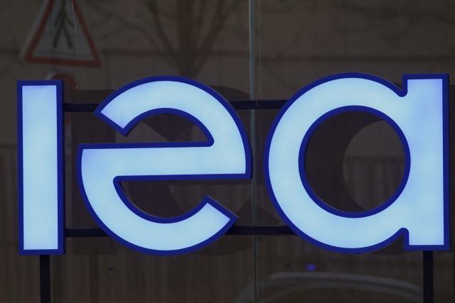 (FILES) This photograph shows the logo of the International Energy Agency (IEA) at the entrance to its headquarters in Paris on March 11, 2026. Liquefied natural gas (LNG) supplies are likely to remain strained through the end of 2027 due to disruptions and infrastructure damage from the US-Iran war, the International Energy Agency said on April 24, 2026. (Photo by Ludovic MARIN / AFP)