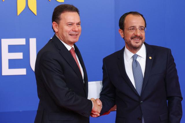 Cyprus' President Nikos Christodoulides (R) welcomes Portugal's Prime Minister Luis Montenegro ahead of an informal meeting of the European Council in Nicosia on April 24, 2026. (Photo by Yves Herman / POOL / AFP)