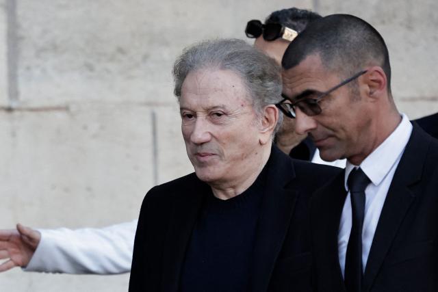 French TV host Michel Drucker arrives to attend the funeral ceremony of French actress Nathalie Baye at the Saint-Sulpice church in Paris on April 24, 2026. French film star Nathalie Baye died on April 17, 2026, at the age of 77. (Photo by STEPHANE DE SAKUTIN / AFP)
