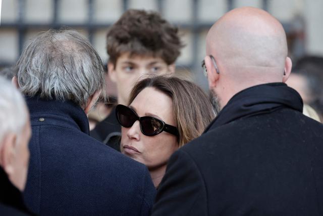 French actress Laura Smet is comforted by guests after attending the funeral ceremony of her mother, French actress Nathalie Baye at the Saint-Sulpice church in Paris on April 24, 2026. French film star Nathalie Baye died on April 17, 2026, at the age of 77. (Photo by STEPHANE DE SAKUTIN / AFP)