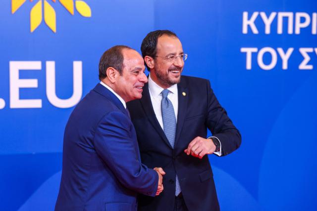 Cyprus' President Nikos Christodoulides (R) welcomes Egypt's President Abdel Fattah al-Sisi in Nicosia on April 24, 2026, on the sidelines of a European summit. European leaders vowed on April 24 to do more to de-escalate conflicts in the Middle East, as they prepared for discussions with regional counterparts from Egypt, Lebanon and Syria in Cyprus. (Photo by Yves Herman / POOL / AFP)